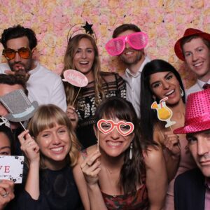 Guests enjoying a fun photo session with an open-air booth.