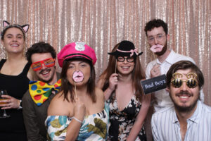 Party props displayed in a basket at a photo booth.